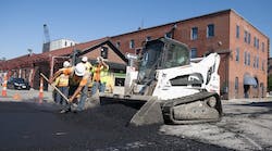 low-res-bobcat-t870-bucket-asphalt-paving-workers